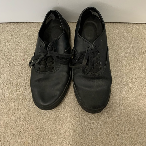 Black faux leather sneakers